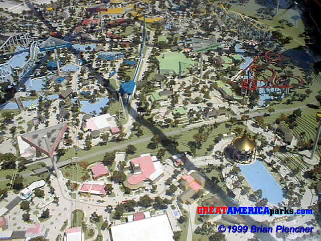 Gurnee model detail
Elevated triangles visible in the model served as markers indicating the name of each themed section. The triangles and rooftops are color coded by themed section. In this photo you can see that Orleans Place was pink, Yankee Harbor was blue, Yukon Territory was red, County Fair was yellow, and Hometown Square was green. This model appears to be current as of the 1978 season because it includes the [i]Tidal Wave[/i], but does not yet have the Pictorium which debuted in Gurnee in 1979.
2 May 1999

Photo courtesy of Brian Plencner.
